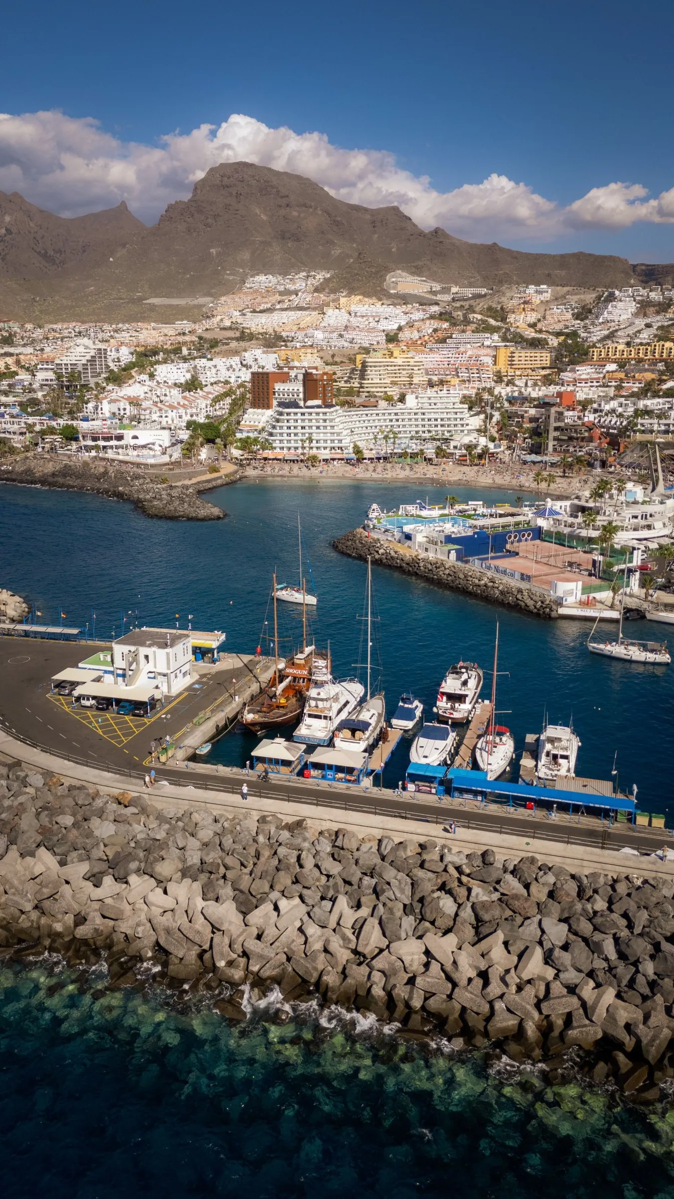 The marina of Puerto Colón with sailing boats and the mountains of the south behind